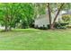Large back yard with lush green lawn extends from the house, providing ample space for recreation at 1595 Chadberry Way, Lawrenceville, GA 30043