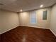 Finished basement with dark wood floors and natural light at 1595 Chadberry Way, Lawrenceville, GA 30043