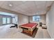 Spacious finished basement featuring carpeting, pool table, and workout equipment at 1595 Chadberry Way, Lawrenceville, GA 30043