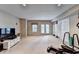 Spacious basement with carpeting, workout equipment, and access to the outside at 1595 Chadberry Way, Lawrenceville, GA 30043