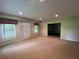 Spacious basement features a door to the exterior and an entrance to another room at 1595 Chadberry Way, Lawrenceville, GA 30043