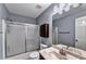 Bathroom features a white vanity, walk-in shower, and linen closet at 1595 Chadberry Way, Lawrenceville, GA 30043