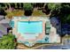 Aerial view of the community pool showcasing ample seating and a gated entrance at 1595 Chadberry Way, Lawrenceville, GA 30043