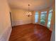 Sunny dining room featuring hardwood floors, and bay window at 1595 Chadberry Way, Lawrenceville, GA 30043