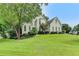 Stunning two-story home with lush landscaping, and pristine curb appeal at 1595 Chadberry Way, Lawrenceville, GA 30043