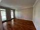 Bright, airy living room features hardwood floors and large windows at 1595 Chadberry Way, Lawrenceville, GA 30043