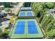 Aerial view of community tennis courts offers residents a fun, competitive recreational amenity at 1595 Chadberry Way, Lawrenceville, GA 30043