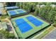 Aerial view of community tennis courts offers residents a fun, competitive recreational amenity at 1595 Chadberry Way, Lawrenceville, GA 30043
