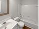 Bathroom showing a sink, toilet, mirror, and tub with shower head at 3968 Oak Glenn Dr, Duluth, GA 30096