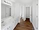 Bathroom boasting double sinks, large mirror, and access to toilet area at 3968 Oak Glenn Dr, Duluth, GA 30096