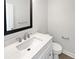 Bathroom featuring vanity with countertop sink, mirror, and toilet at 3968 Oak Glenn Dr, Duluth, GA 30096