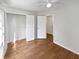 Bedroom boasting wood floors, white trim, and access to the closet at 3968 Oak Glenn Dr, Duluth, GA 30096