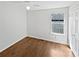 Bright bedroom featuring wood floors, white walls, and a ceiling fan at 3968 Oak Glenn Dr, Duluth, GA 30096