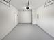Clean garage featuring painted floor, door to the house, and garage door at 3968 Oak Glenn Dr, Duluth, GA 30096