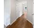 Hallway featuring hardwood floors and white doors at 3968 Oak Glenn Dr, Duluth, GA 30096