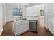 Modern kitchen with stainless steel appliances, double sink, and lots of natural light at 3968 Oak Glenn Dr, Duluth, GA 30096