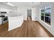 Well-lit living area featuring hardwood floors and a large window for natural light at 3968 Oak Glenn Dr, Duluth, GA 30096
