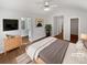 Comfortable bedroom with vaulted ceiling, ceiling fan, and en suite bathroom access at 3968 Oak Glenn Dr, Duluth, GA 30096