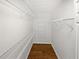 Spacious walk-in closet with adjustable white wire shelving and wood floor at 3968 Oak Glenn Dr, Duluth, GA 30096