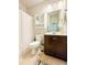 Cozy bathroom with a shower, vanity, and mirrored medicine cabinet at 724 Laura Jean Ct, Buford, GA 30518