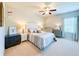 Carpeted bedroom with a full-sized bed, and dresser at 724 Laura Jean Ct, Buford, GA 30518