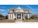 Charming clubhouse with stone accents, manicured landscaping, and a welcoming entrance at 724 Laura Jean Ct, Buford, GA 30518