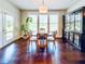 Eat-in kitchen area is surrounded by natural light and a stylish display cabinet at 724 Laura Jean Ct, Buford, GA 30518