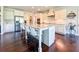 Bright kitchen boasts a large island, stainless steel appliances, and white cabinetry at 724 Laura Jean Ct, Buford, GA 30518