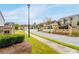 Scenic view of the Woodward Preserve neighborhood showcasing well-maintained lawns, sidewalks, and attractive homes at 724 Laura Jean Ct, Buford, GA 30518
