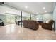 Spacious finished basement area with tile flooring, pool table, television and two brown reclining chairs at 1206 Mountainside Nw Trce, Kennesaw, GA 30152