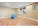 Spacious basement featuring a window, wood floors, and an exercise area at 1206 Mountainside Nw Trce, Kennesaw, GA 30152