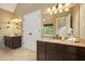 Bathroom view featuring a double vanity sink, granite countertop and bright lighting at 1206 Mountainside Nw Trce, Kennesaw, GA 30152