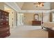 Large bedroom showcasing ample space, neutral colors, carpet, and a ceiling fan at 1206 Mountainside Nw Trce, Kennesaw, GA 30152