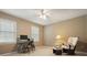 Bedroom featuring neutral decor, two windows, desk, computer and a comfortable sitting area with a rocking chair at 1206 Mountainside Nw Trce, Kennesaw, GA 30152