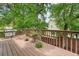 Wooden deck with a grill, offering an ideal space for entertaining outdoors at 1206 Mountainside Nw Trce, Kennesaw, GA 30152