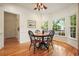 Bright dining area featuring a bay window and wooden table and chairs at 1206 Mountainside Nw Trce, Kennesaw, GA 30152