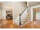 Traditional foyer with hardwood floors, staircase with carpet runner, and views into adjacent living spaces at 1206 Mountainside Nw Trce, Kennesaw, GA 30152