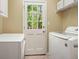 Functional laundry room with washer, dryer, and utility sink at 1206 Mountainside Nw Trce, Kennesaw, GA 30152