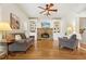 Cozy living room with hardwood floors, built-in bookshelves, stone fireplace and ample seating at 1206 Mountainside Nw Trce, Kennesaw, GA 30152
