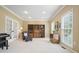 Spacious living room with natural light, carpet flooring, and a beautiful bookshelf at 1206 Mountainside Nw Trce, Kennesaw, GA 30152