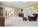 Comfortable living room with a piano, chair and ottoman, and French doors at 1206 Mountainside Nw Trce, Kennesaw, GA 30152