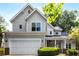 Charming two-story home featuring a well-manicured lawn, covered porch, and attached two-car garage at 1607 Boulder Walk Se Dr, Atlanta, GA 30316