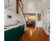 Inviting home foyer with beautiful hardwood floors, a staircase, and a glimpse into the spacious living area at 1607 Boulder Walk Se Dr, Atlanta, GA 30316
