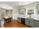 Charming kitchen boasts shaker cabinets, white countertops, black appliances, subway tile backsplash, and hardwood floors at 1607 Boulder Walk Se Dr, Atlanta, GA 30316