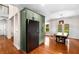 Stylish kitchen area featuring stainless steel refrigerator, wooden dining table, pendant lighting and hardwood flooring at 1607 Boulder Walk Se Dr, Atlanta, GA 30316