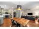 Spacious open-concept kitchen and living room area featuring hardwood floors and modern stainless steel appliances at 1607 Boulder Walk Se Dr, Atlanta, GA 30316