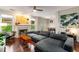 Bright living room featuring a fireplace, hardwood floors, a large sectional sofa, and ample natural light at 1607 Boulder Walk Se Dr, Atlanta, GA 30316