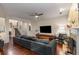 Comfortable living room with hardwood floors, a fireplace, and a large television for relaxing evenings at 1607 Boulder Walk Se Dr, Atlanta, GA 30316