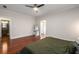Large main bedroom with hardwood floors, ceiling fan, neutral paint and ensuite bath with stand-up shower at 1607 Boulder Walk Se Dr, Atlanta, GA 30316