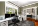 Bright office area with great light, featuring built-in shelving and French doors at 1607 Boulder Walk Se Dr, Atlanta, GA 30316